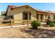 Charming single-story home with a tile roof and arched entryway, surrounded by desert landscaping at 4495 E Woodside Way, Gilbert, AZ 85297