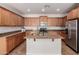 Spacious kitchen featuring granite countertops, stainless steel appliances, and an island at 4495 E Woodside Way, Gilbert, AZ 85297