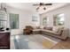 Comfortable living room featuring a sectional sofa and large windows that brighten the space at 4495 E Woodside Way, Gilbert, AZ 85297