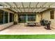 Outdoor patio area with a pergola, grill, and dining set, perfect for entertaining at 4495 E Woodside Way, Gilbert, AZ 85297