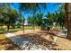 Colorful playground area featuring swings and a play structure at 4495 E Woodside Way, Gilbert, AZ 85297
