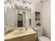 Bright bathroom featuring a vanity with sink, mirror, toilet, and stylish decor in a cozy space at 520 N Stapley Dr # 181, Mesa, AZ 85203
