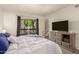 Bright bedroom featuring a large window with natural light, dresser, and cozy furnishings at 520 N Stapley Dr # 181, Mesa, AZ 85203
