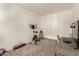 A cozy bedroom featuring neutral carpet, a closet, and a desk area, perfect for a home office or study space at 520 N Stapley Dr # 181, Mesa, AZ 85203
