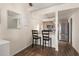 Cozy dining area next to the kitchen with breakfast bar, wood floors, and natural lighting at 520 N Stapley Dr # 181, Mesa, AZ 85203