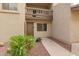 Exterior view of the home showcasing the front door, balcony, and landscape at 520 N Stapley Dr # 181, Mesa, AZ 85203