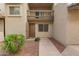 Exterior view of the home showcasing the front door, balcony, and landscape at 520 N Stapley Dr # 181, Mesa, AZ 85203