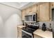 Kitchen featuring stainless steel appliances and updated cabinets at 520 N Stapley Dr # 181, Mesa, AZ 85203