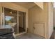 Covered patio featuring a sliding glass door and a small storage access at 520 N Stapley Dr # 181, Mesa, AZ 85203