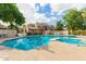 Inviting community pool and spa area with lounge chairs, surrounded by lush landscaping at 520 N Stapley Dr # 181, Mesa, AZ 85203