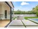 Outdoor living space with a built-in grill, a pristine pool, and lush landscaping for ultimate relaxation at 5410 E Verde Ln, Phoenix, AZ 85018