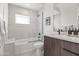 Modern bathroom with marble accents, a glass-enclosed shower, and stylish fixtures for a spa-like feel at 5410 E Verde Ln, Phoenix, AZ 85018