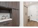 Well-organized pantry with sleek cabinetry and ample storage, blending style with functionality at 5410 E Verde Ln, Phoenix, AZ 85018