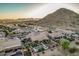 Backyards with pools and desert landscaping near a prominent mountain in a beautiful community at 582 W Stirrup Ln, San Tan Valley, AZ 85143