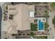 Overhead view of home and backyard, showcasing the swimming pool, turf, desert landscaping, and roof at 582 W Stirrup Ln, San Tan Valley, AZ 85143