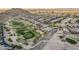Scenic aerial view of a golf course community with mountain views at 582 W Stirrup Ln, San Tan Valley, AZ 85143