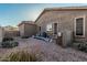 Low maintenance backyard featuring desert landscaping and gravel, with an air conditioning unit at 582 W Stirrup Ln, San Tan Valley, AZ 85143