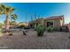 Backyard featuring desert landscaping and a privacy fence, with a view of the house from the yard at 582 W Stirrup Ln, San Tan Valley, AZ 85143