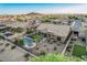 Enjoy a private backyard oasis featuring a refreshing pool and desert landscaping in a tranquil setting at 582 W Stirrup Ln, San Tan Valley, AZ 85143