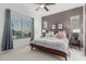 A cozy bedroom featuring natural light, a ceiling fan, and neutral colored walls at 582 W Stirrup Ln, San Tan Valley, AZ 85143