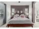 A comfortable bedroom featuring a ceiling fan, carpeted floors, and great natural light at 582 W Stirrup Ln, San Tan Valley, AZ 85143