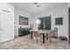Bright dining area with a glass table, neutral decor, and a view of the backyard at 582 W Stirrup Ln, San Tan Valley, AZ 85143