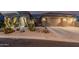 Inviting home with a well-maintained desert front yard and convenient two-car garage at 582 W Stirrup Ln, San Tan Valley, AZ 85143