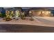 Inviting single-story home featuring desert landscaping, a two-car garage, and a tile roof at 582 W Stirrup Ln, San Tan Valley, AZ 85143