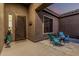 Charming front porch with seating area providing a warm welcome to this inviting home at 582 W Stirrup Ln, San Tan Valley, AZ 85143