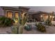 Stylish home with drought-tolerant desert landscaping, cacti, and a stone walkway at 582 W Stirrup Ln, San Tan Valley, AZ 85143