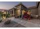 Charming desert landscaping featuring cacti, colorful flowering bushes, and rock ground cover at 582 W Stirrup Ln, San Tan Valley, AZ 85143