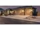 A beautiful home featuring a two-car garage and low maintenance desert landscaping at 582 W Stirrup Ln, San Tan Valley, AZ 85143