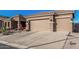 Inviting curb appeal with drought-friendly landscaping and a convenient attached two-car garage at 582 W Stirrup Ln, San Tan Valley, AZ 85143