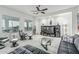 Comfortable living room with modern decor, and a stylish leather sofa and lounge chairs at 582 W Stirrup Ln, San Tan Valley, AZ 85143
