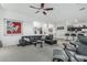 Inviting living room with comfortable leather seating, neutral carpet and bright lighting at 582 W Stirrup Ln, San Tan Valley, AZ 85143
