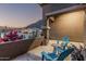 Cozy front patio featuring comfortable seating and scenic views of the surrounding desert landscape at 582 W Stirrup Ln, San Tan Valley, AZ 85143