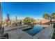 Inviting pool with a stone patio and a table and chairs perfect for entertaining on a hot Arizona day at 582 W Stirrup Ln, San Tan Valley, AZ 85143