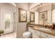 Bathroom with a vanity, mirror, and a glass-enclosed shower at 5953 W Aurora Dr, Glendale, AZ 85308