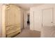 Bright bedroom featuring a large wardrobe, closet, and access to additional rooms at 5953 W Aurora Dr, Glendale, AZ 85308
