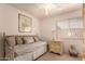 Comfortable bedroom featuring daybed, side table, ceiling fan, and decor at 5953 W Aurora Dr, Glendale, AZ 85308