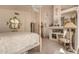 Charming main bedroom features a four-poster bed, elegant decor, and a cozy ambiance at 5953 W Aurora Dr, Glendale, AZ 85308
