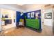 Eclectic bedroom showcasing a green dresser, unique decor, and a glimpse into the adjacent bathroom at 6314 N 14Th St, Phoenix, AZ 85014