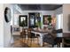 Open concept dining room has an industrial-style light fixture, and an inviting atmosphere with decor at 6314 N 14Th St, Phoenix, AZ 85014
