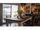 Open dining room, decorated with decorative plants and an outside view adds to the bright, airy ambiance at 6314 N 14Th St, Phoenix, AZ 85014