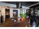 An open dining room boasts natural lighting, decorative art and plants that creates an inviting atmosphere for gatherings at 6314 N 14Th St, Phoenix, AZ 85014