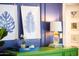 Stylish interior featuring a green dresser with tropical prints and a pineapple-shaped lamp at 6314 N 14Th St, Phoenix, AZ 85014
