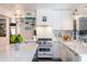 Kitchen with an island provides plenty of counter space; modern appliances and stylish decor blend form and function at 6314 N 14Th St, Phoenix, AZ 85014