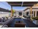 Relaxing outdoor space featuring comfortable seating under a shade canopy with tasteful accents at 6314 N 14Th St, Phoenix, AZ 85014