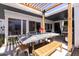 Outdoor patio and dining area featuring overhead pergola, spacious seating, and modern shade options at 6314 N 14Th St, Phoenix, AZ 85014