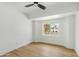 Bright, empty bedroom with light wood floors and a window with a view of the neighborhood at 6351 E Waltann Ln, Scottsdale, AZ 85254